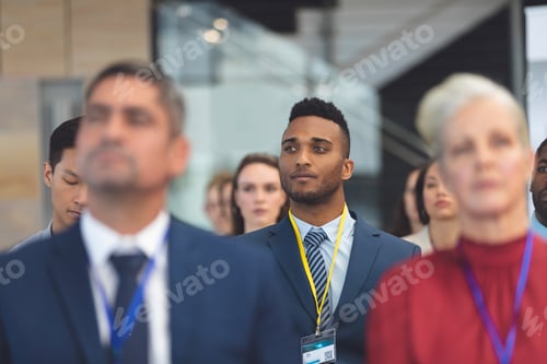 Preview: Front view of attentive young African american businessman in a business seminar in office building