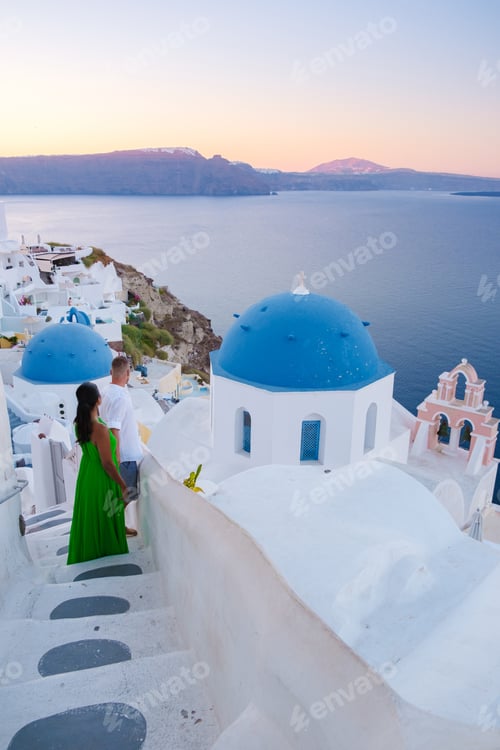 Preview: Couple on vacation in Santorini Greece, men and women at the Greek village of Oia
