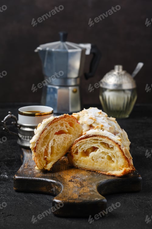 Preview: Crispy croissant with caramel filling cut on half with espresso