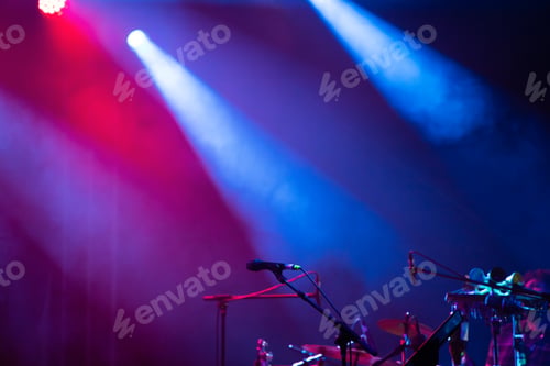 Preview: Colorful stage lights and microphone at concert
