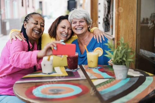 Preview: Happy multiracial senior woman using mobile phone at bar restaurant - Focus on right female face