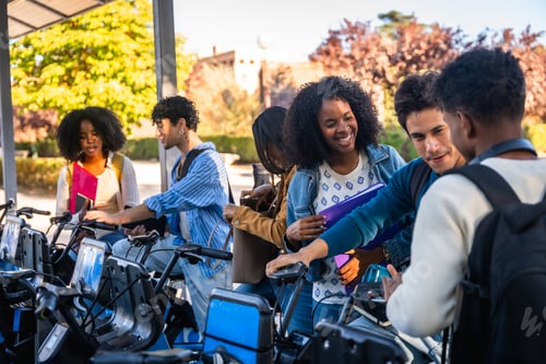 Preview: Diverse students renting bikes on university campus