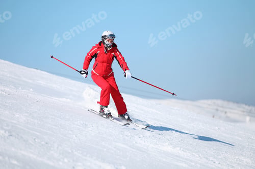 Preview: Girl skier on the slope at ski resort