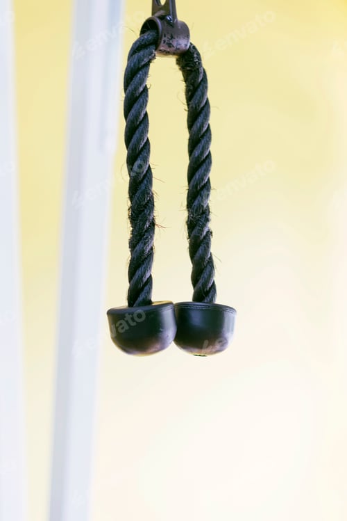 Preview: Close up view of a handle of a hand pull machine in a modern fitness center. Gym equipment