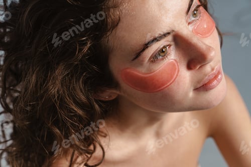 Preview: Beautiful half-naked nice girl posing with eye patches