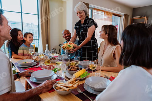 Preview: Family and friends reunion at home. family gathering enjoying dinner party meal together