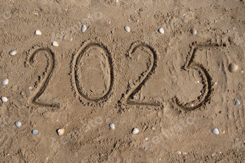 Preview: The numbers 2025 are handwritten on the sand, on the seashore, seashell.