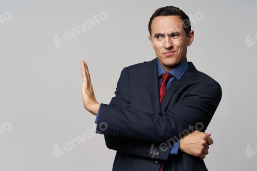 Preview: business man in a suit gesturing with his hand displeased boss