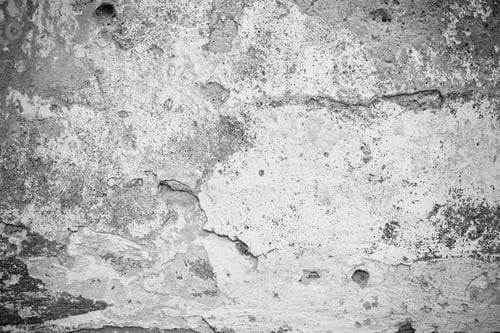 Preview: Cracked concrete wall covered with gray cement surface. Grey old wall with shabby damaged plaster or