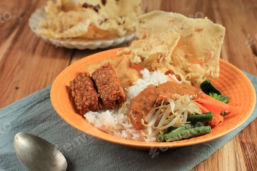 Preview: Nasi Pecel. Traditional Javanese Rice Dish of Steamed Rice with Vegetable Salad, Peanut Dressing