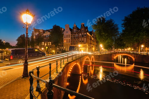 Preview: Amsterdam canal, bridge and medieval houses in the evening