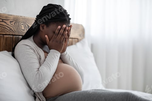 Preview: Emotional Changes During Pregnancy. Upset Black Pregnant Woman Covering Face With Hands