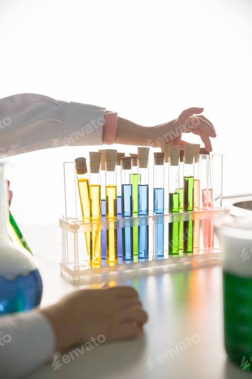 Preview: Schoolchild making experiment with test tubes in chemical laboratory