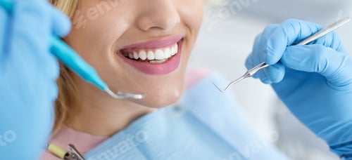 Preview: Closeup of female patient showing her beautiful white teeth