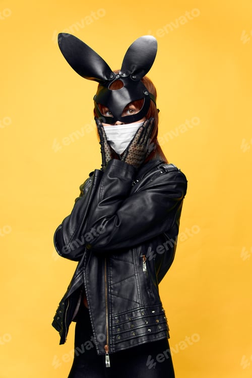 Preview: Female rabbit mask posing sexually in a medical mask from coronavirus