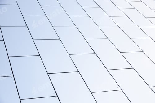 Preview: Wide angle view of white smooth matte wall of geometrically designed building