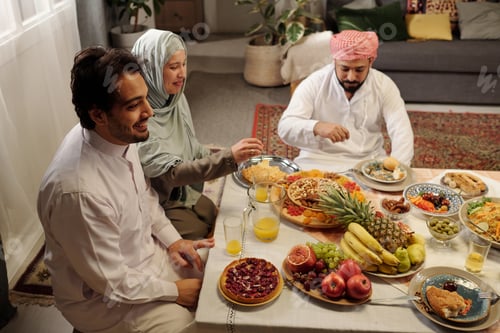 Preview: Happy Muslim Family Having Festive Dinner