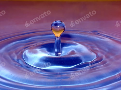 Preview: Macro Photograph of Droplet Creating Ripples on Liquid