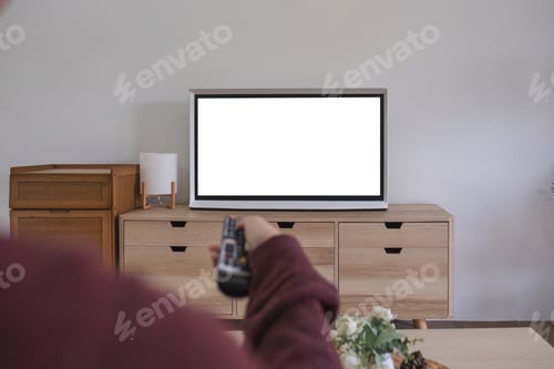 Preview: Young beautiful Asian woman is watching a fun movie on television at home. Attractive casual girl