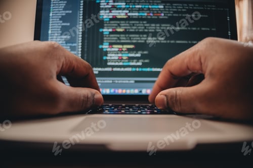 Preview: African American man sitting in front of computer coding, programming, web developer