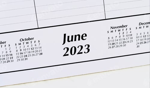 Preview: Overhead view of June 2023 on desk calendar