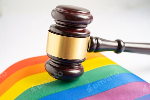 Preview: Gavel for judge lawyer on rainbow flag, symbol of LGBT pride month celebrate annual in June