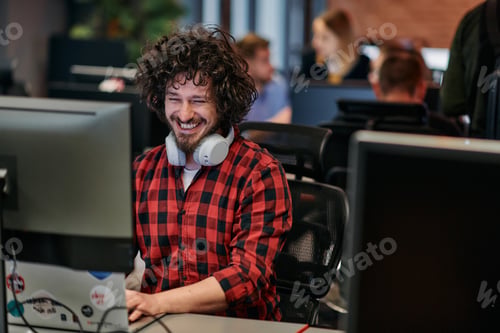 Preview: Focused Programmer With Afro Hairstyle in Plaid Shirt Working on Computer in Office Environment