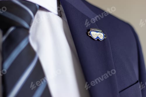 Preview: Steamboat ski goggles lapel pin on suit jacket