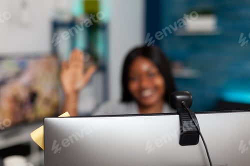 Preview: Close up of webcam on monitor used for video call meeting