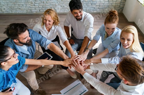 Preview: Happy diverse success business team celebrating success and having fun all together.