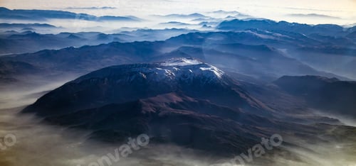 Preview: Aerial view of alps mountains covered with snow.