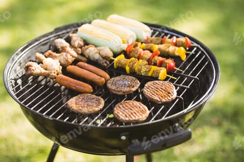 Preview: Skewers on barbecue grill in garden