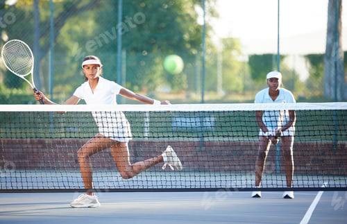 Preview: Tennis, fitness and a sports woman hitting a ball over a net during a competitive game to return a