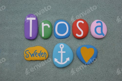 Preview: Trosa, Sweden, souvenir composed with multi colored stone letters over green sand