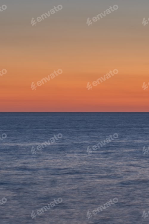 Preview: Sailboat on the ocean at sunset near the shore