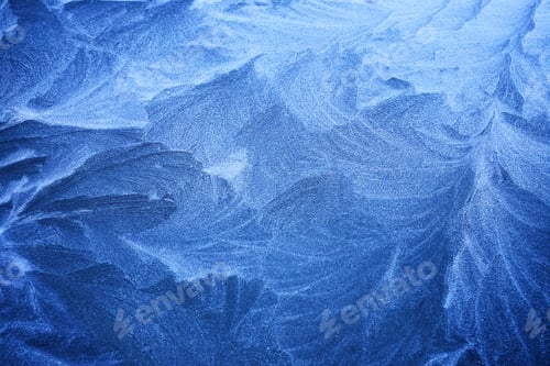 Preview: Frosted Patterns. Close-up of intricate icy frost patterns on a surface, predominantly blue hues.