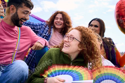 Preview: Group of diverse young people smiling in gay pride festival day holding rainbows fans