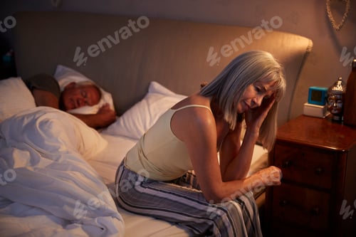 Preview: Worried Senior Woman In Bed At Night Suffering With Insomnia