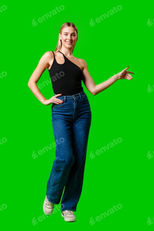 Preview: Young Woman Pointing at Something against green background