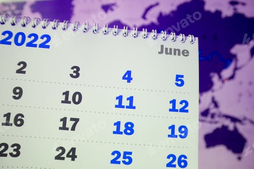 Preview: Close-up of a page of a paper calendar with a spiral for the month of June for 2022