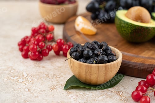 Preview: A wooden bowls full of delicious berries