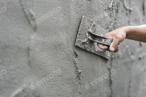 Preview: Hand plasterer plastering cement wall background, hand worker brush rough concrete floor for smooth