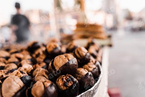 Preview: Roasted chestnuts on pan, street market snack