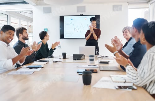 Preview: Shot of a group of businesspeople clapping during a meeting in a modern office