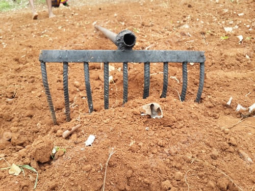 Preview: Closeup shot of a rake in the soil - perfect for an agriculture concept