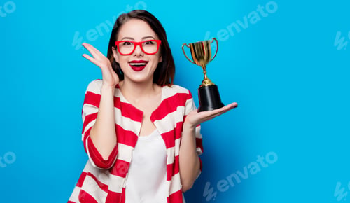 Preview: young smiling woman with cup trophy