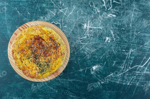 Preview: Delicious pastry with poppy seeds on a wooden plate