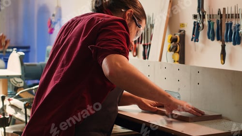 Preview: Manufacturer and apprentice performing tasks on wood shaper