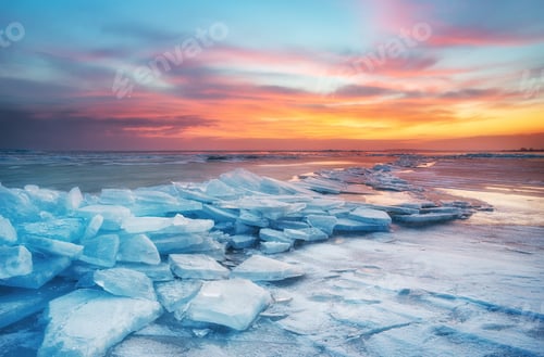 Preview: Winter landscape on seashore during sunset. Lofoten islands, Norway.