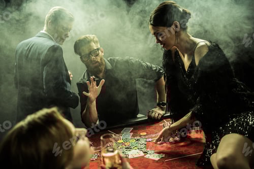 Preview: side view of group of people playing poker together in casino